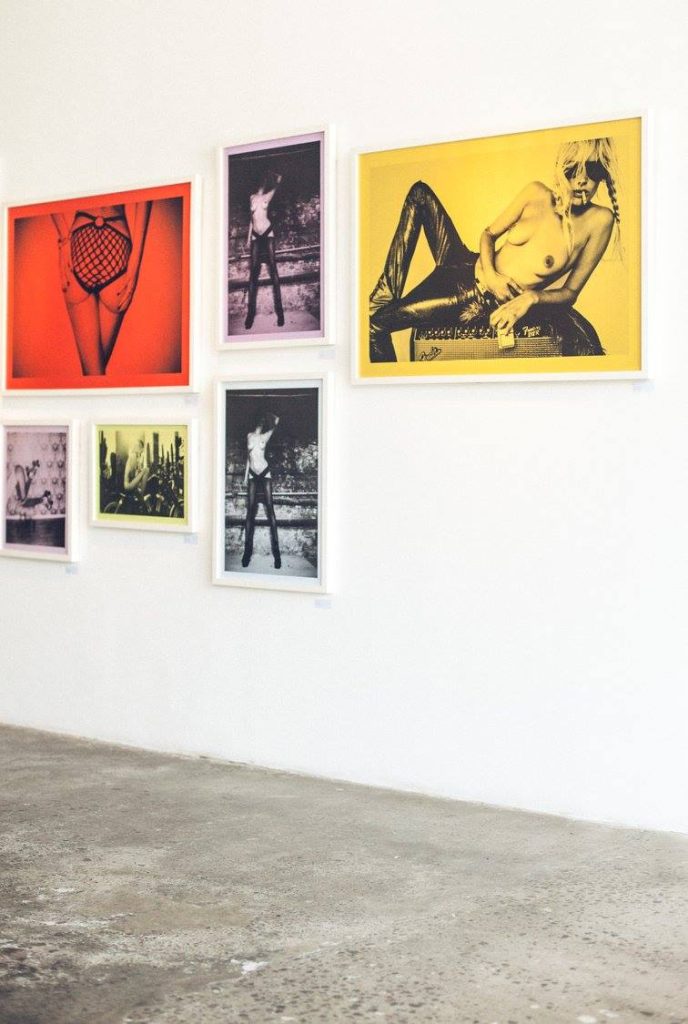 Colour-tinted framed photographs by Kate Bellm on a white gallery wall for 'Died Pretty' at The Slow