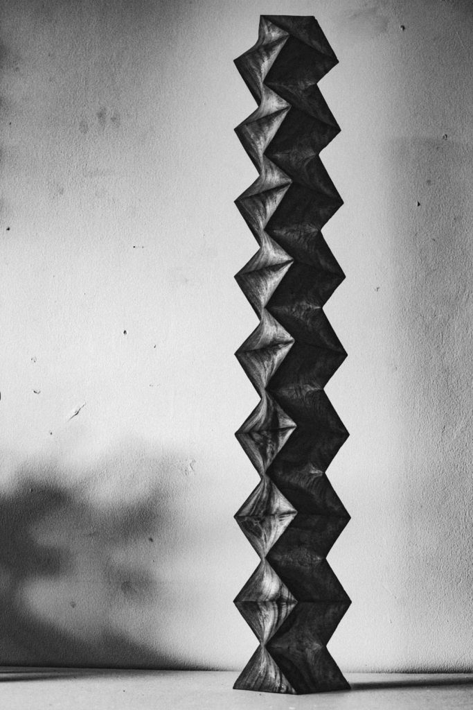 Tall zigzag hand-carved wooden sculpture by Aleph Geddis from the 'torii' exhibition
